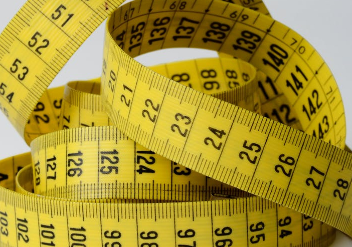close up photo of yellow tape measure